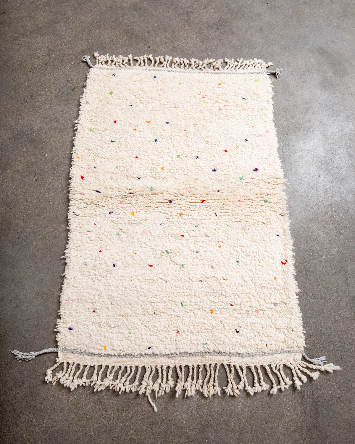Modern, designer, handcrafted Berber rug from Morocco. Beniourain carpet with beautiful colours and patterns and fluffy wool texture.